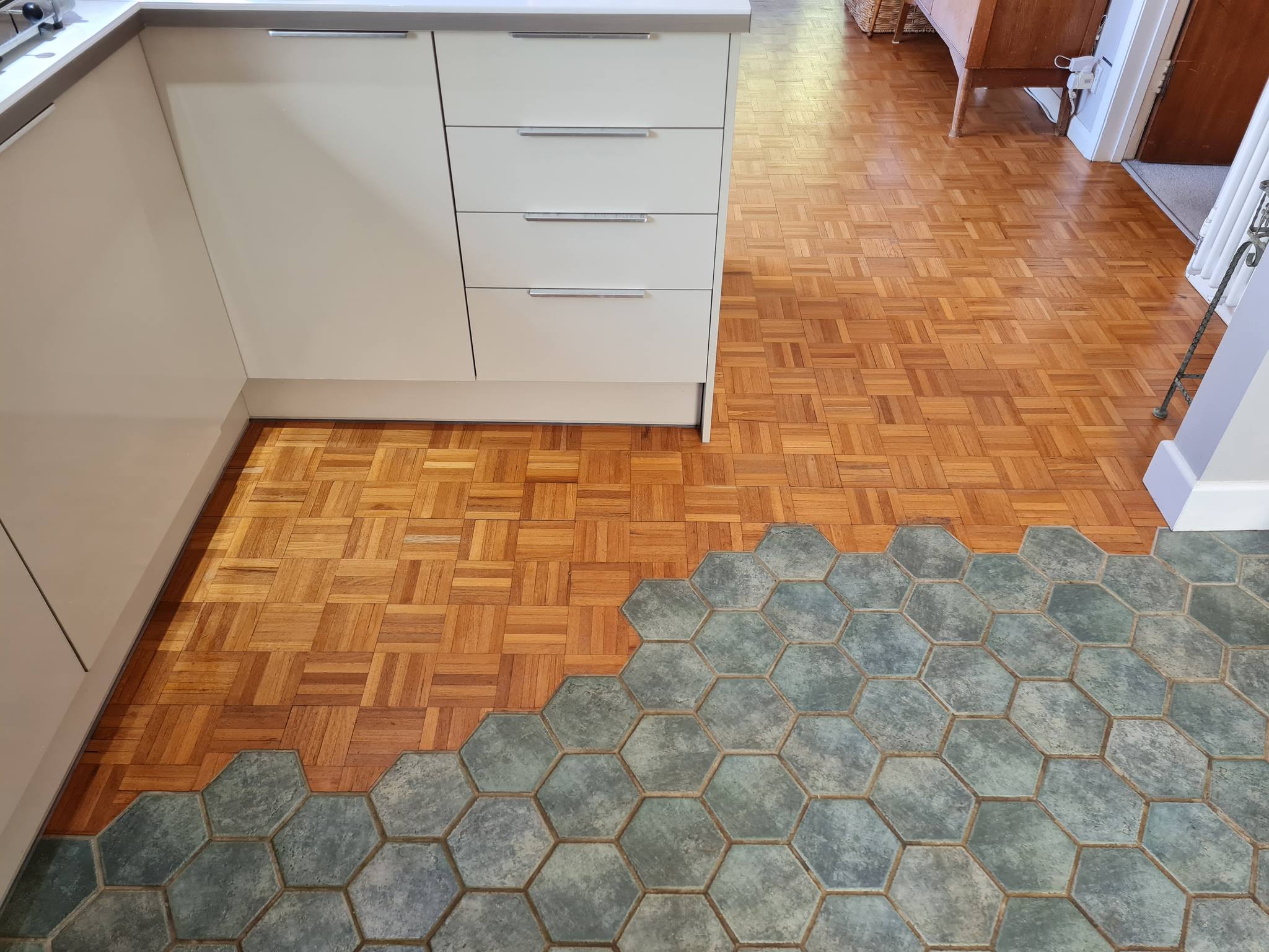 Original flooring integration following renovations and new kitchen